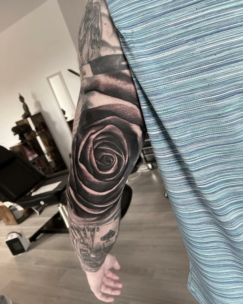 Rose Hand Black And White Tattoo